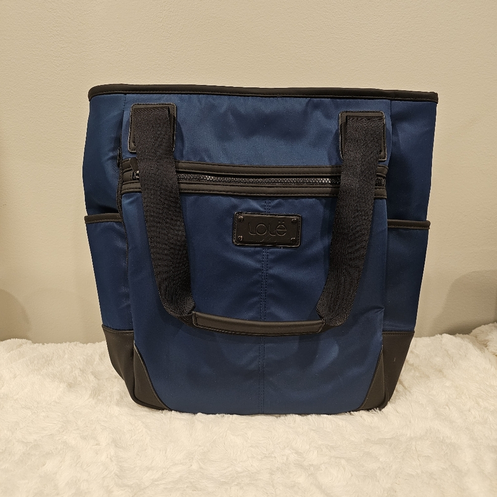 Like New- Lolë Brand convertible backpack and shoulder bag in a beautiful blue.